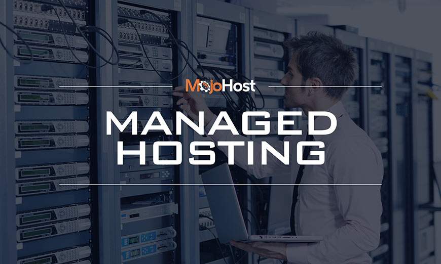 Graphic showing white sans-serif type and MojoHost logo over photo of a man using a laptop in a data center