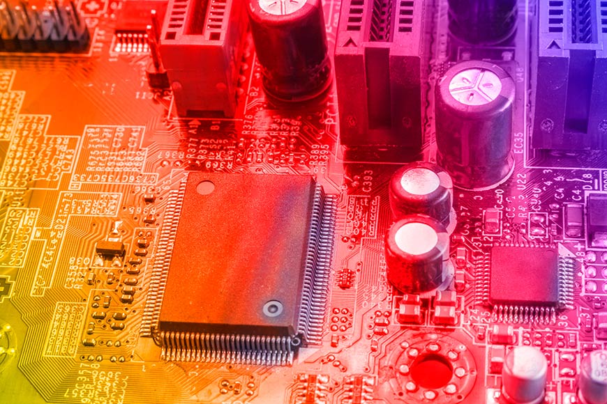 Photo of computer chip with colored light
