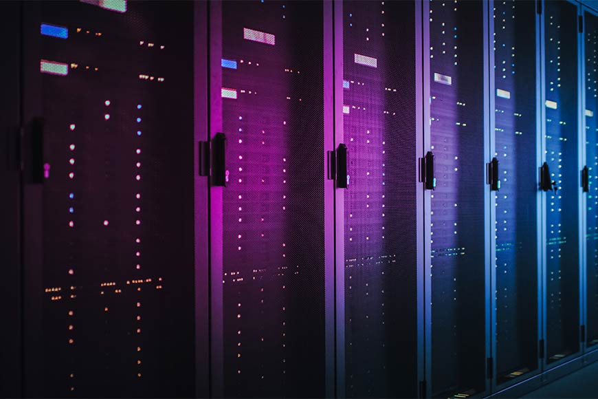 Photo of data center in magenta and blue tones