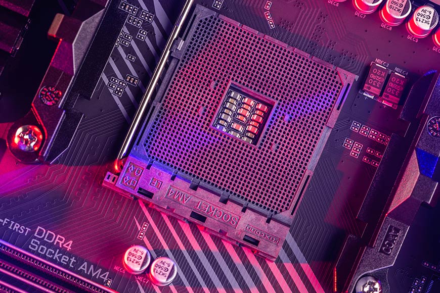 Close up of the AM4 socket for the motherboard with neon red and pink lights